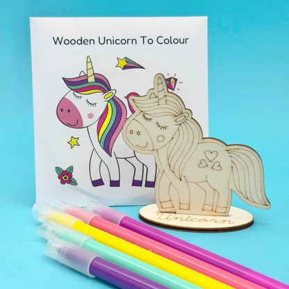 Wooden Unicorn to Colour; optional choice for a unicorn build-your-own party bag; supplied uncoloured, pens not included; coloured example shows decorating ideas.