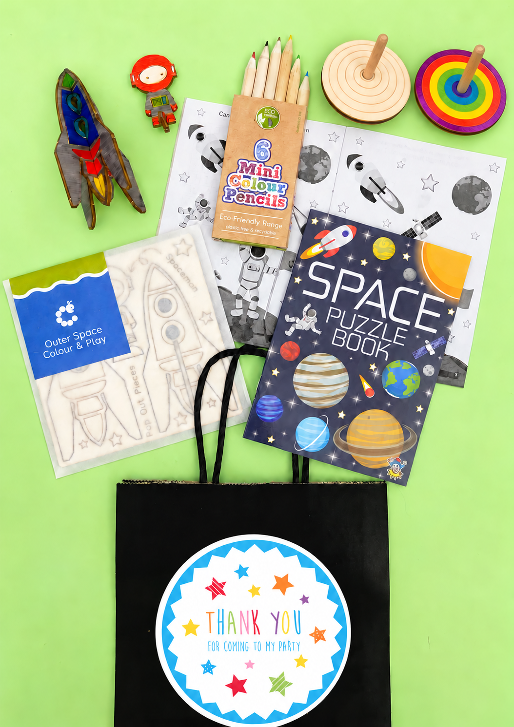 Eco Space Party Bag showing its included contents; one assorted version of each item supplied; one uncoloured spiral spinner included, coloured example shown for inspiration