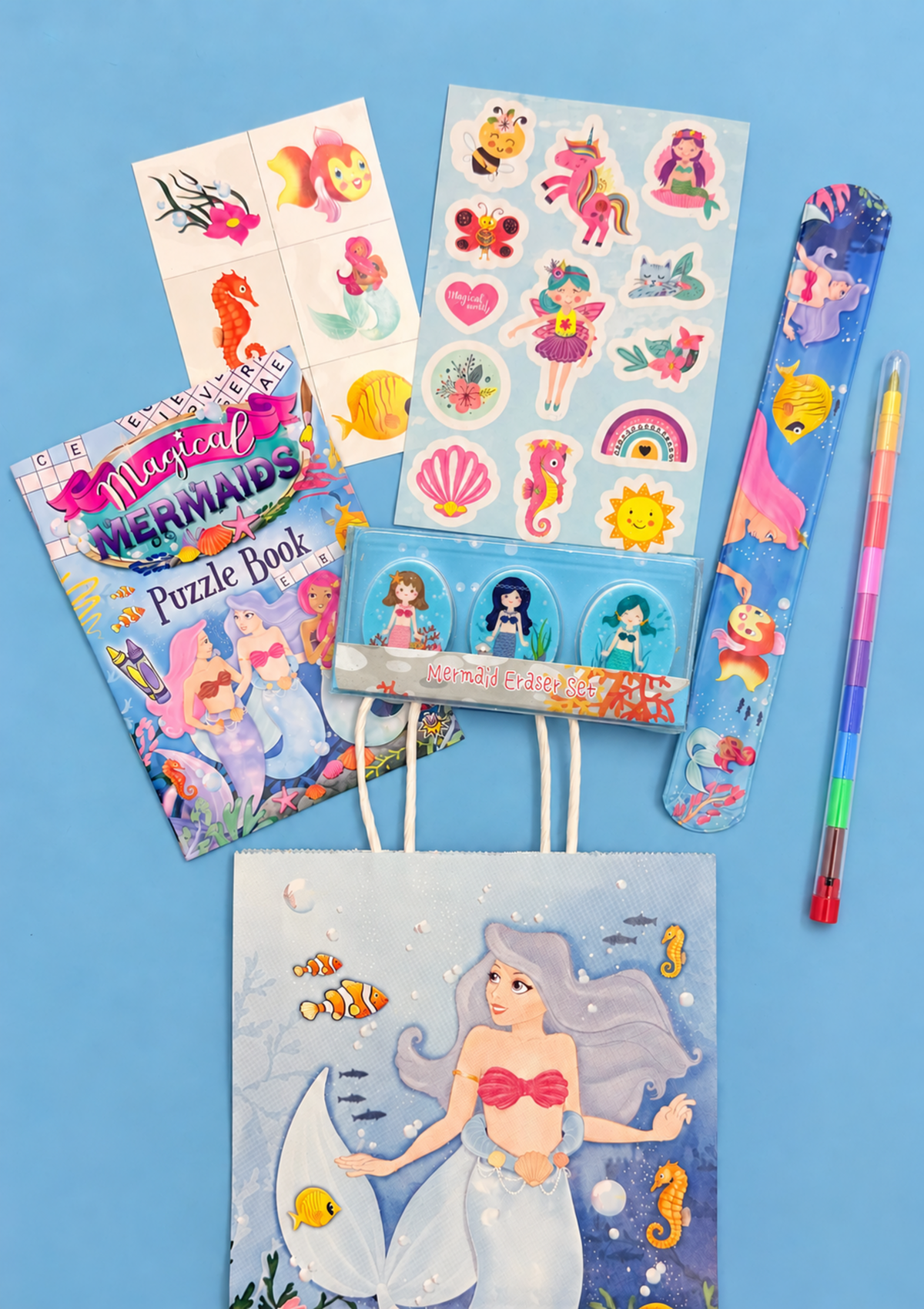 Mermaid value party bag with sticker sheet, snap bracelet, tattoos, puzzle book, mermaid eraser set and rainbow nib pencil