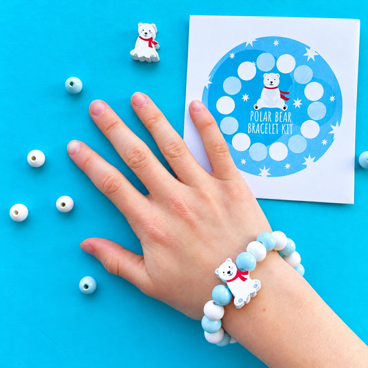 DIY Christmas polar bear bracelet with blue and white beads and paper envelope